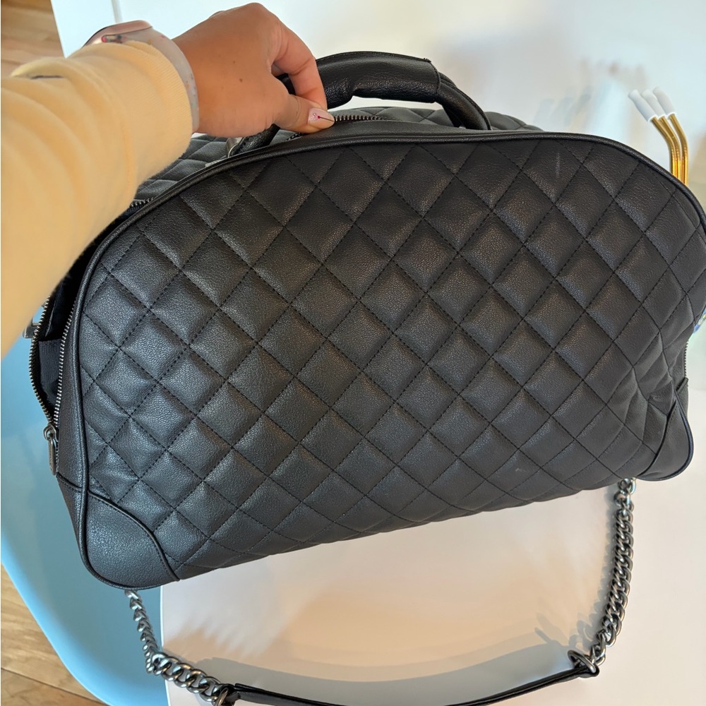 CHANEL Quilted Black Travel bag with Chain Strap